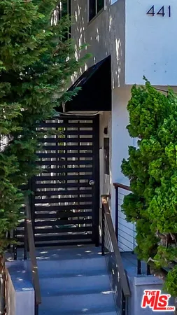 a view of a balcony with wooden floor