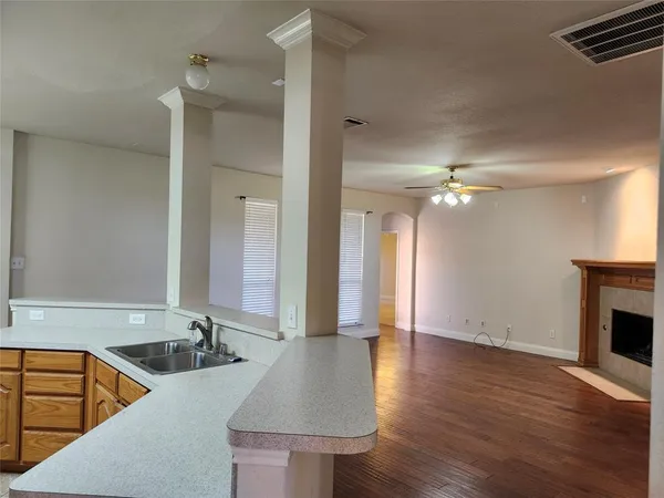 a bathroom with a sink double vanity granite and a shower