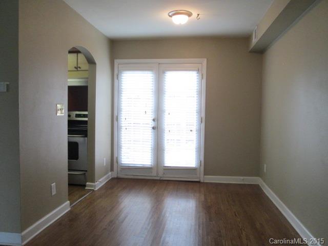 4327 Walker Road, Unit B Charlotte, NC 28211 - Photo 4 of 5 an empty room with wooden floor and windows