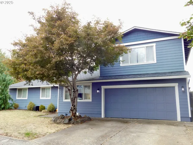 a front view of a house with a garage