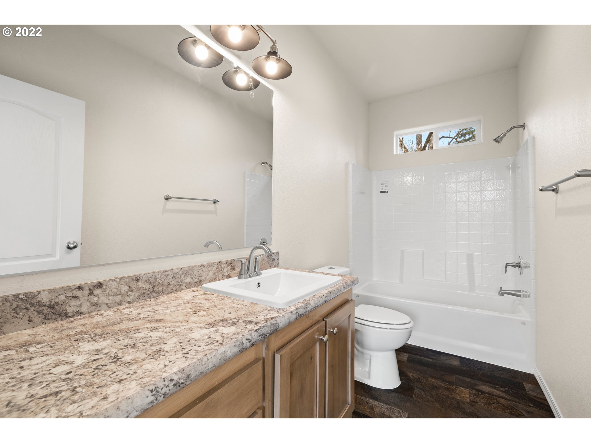 9700 Southwest Tualatin Road, Unit 12 Tualatin, OR 97062 - Photo 14 of 30 a bathroom with a granite countertop sink a toilet and shower