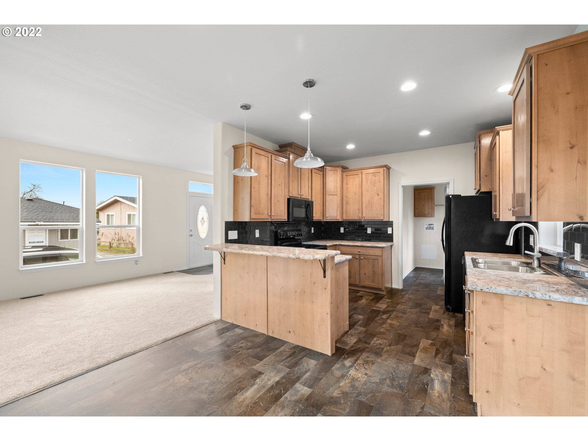9700 Southwest Tualatin Road, Unit 12 Tualatin, OR 97062 - Photo 20 of 30 a kitchen with a refrigerator and a sink