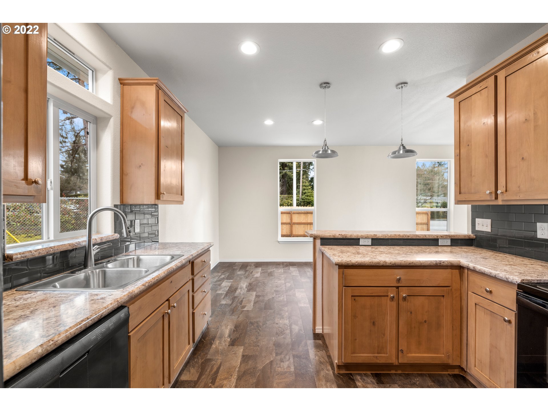 9700 Southwest Tualatin Road, Unit 12 Tualatin, OR 97062 - Photo 24 of 30 a kitchen with granite countertop a sink stainless steel appliances and cabinets