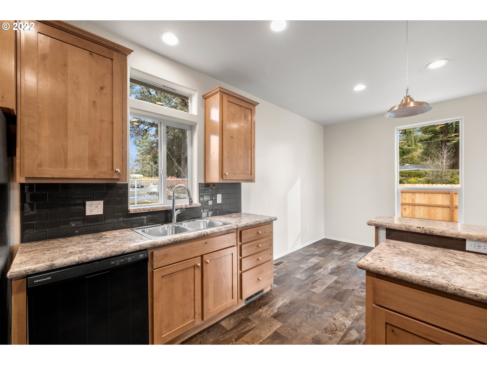 9700 Southwest Tualatin Road, Unit 12 Tualatin, OR 97062 - Photo 25 of 30 a kitchen with granite countertop a sink and a window