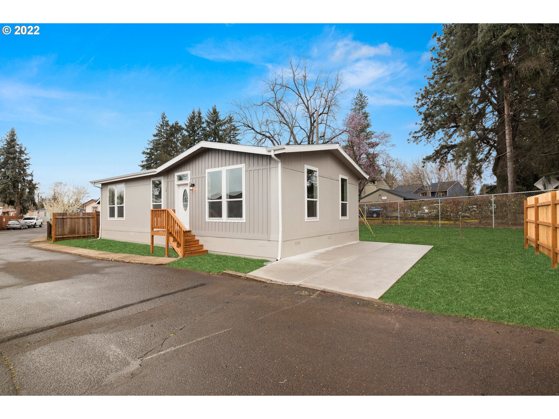 9700 Southwest Tualatin Road, Unit 12 Tualatin, OR 97062 - Photo 29 of 30 a view of a yard in front of a house with a big yard