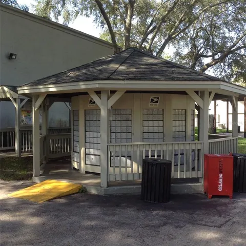 a sign that is in front of flowers