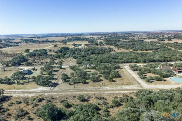 an aerial view of house with yard