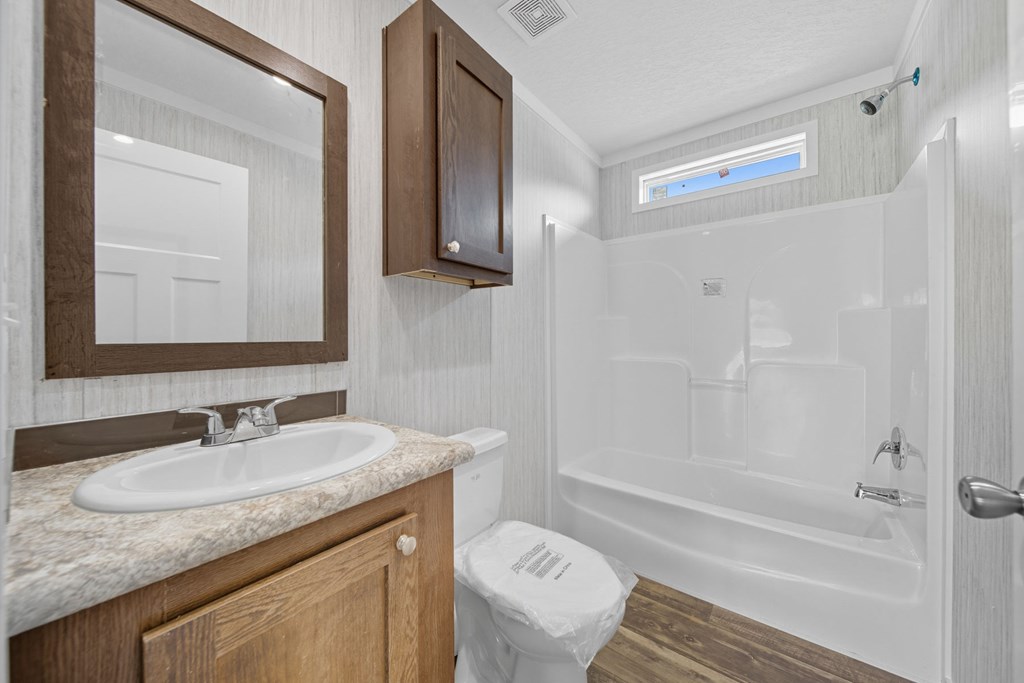 42 Divine Drive Murphy, NC 28906 - Photo 3 of 10 a bathroom with a granite countertop sink toilet and shower