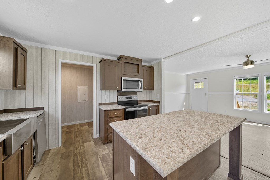 42 Divine Drive Murphy, NC 28906 - Photo 7 of 10 a kitchen with a stove a refrigerator and a sink