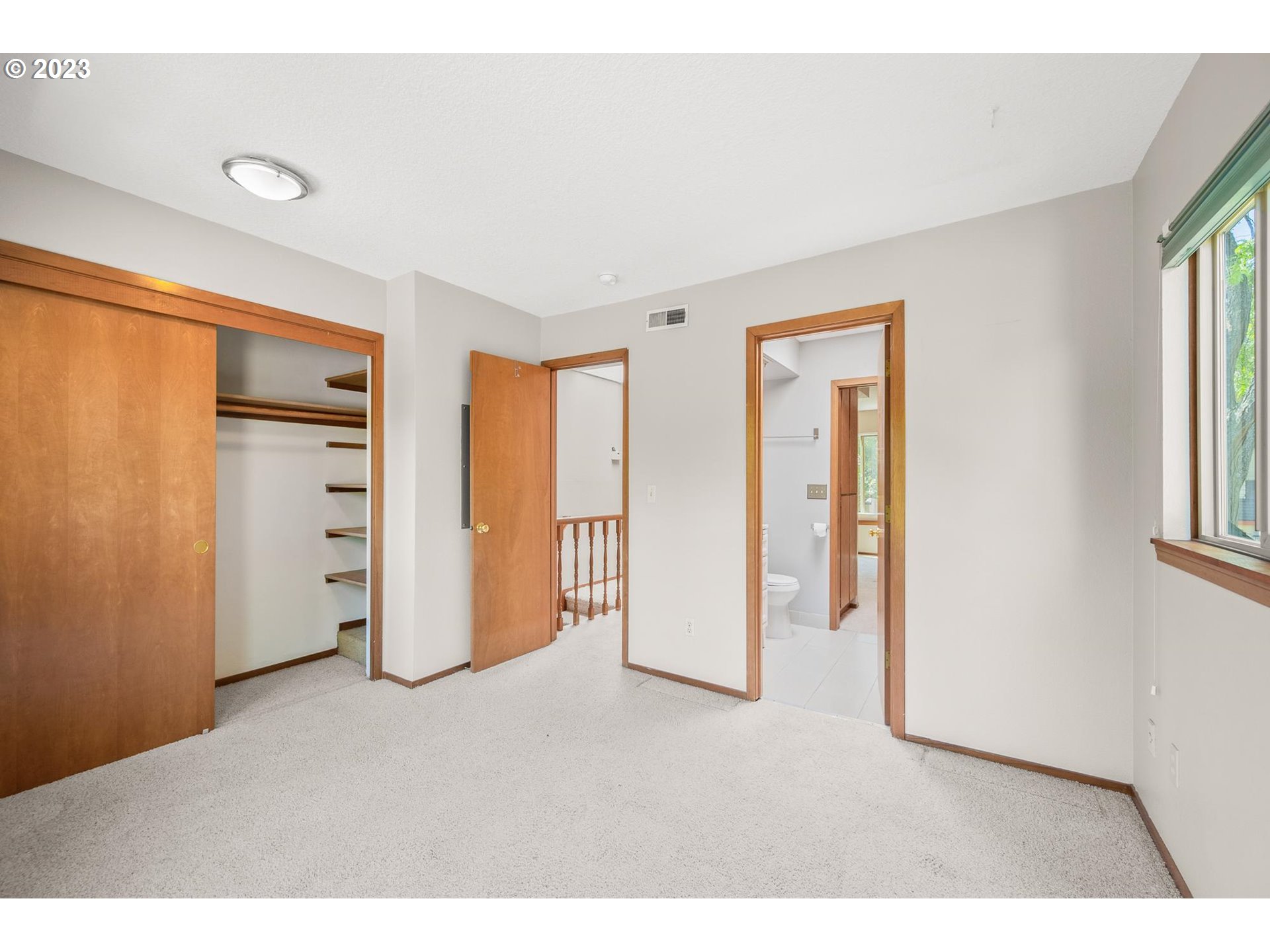 2785 Northwest Upshur Street, Unit B Portland, OR 97210 - Photo 18 of 35 a view of an empty room with a window
