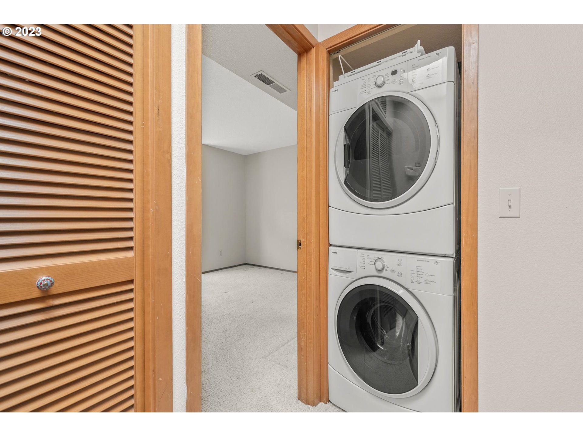 2785 Northwest Upshur Street, Unit B Portland, OR 97210 - Photo 20 of 35 a view of a hallway with washer and dryer