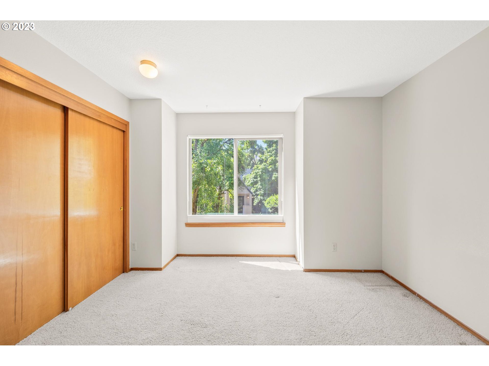 2785 Northwest Upshur Street, Unit B Portland, OR 97210 - Photo 21 of 35 a view of an empty room and window