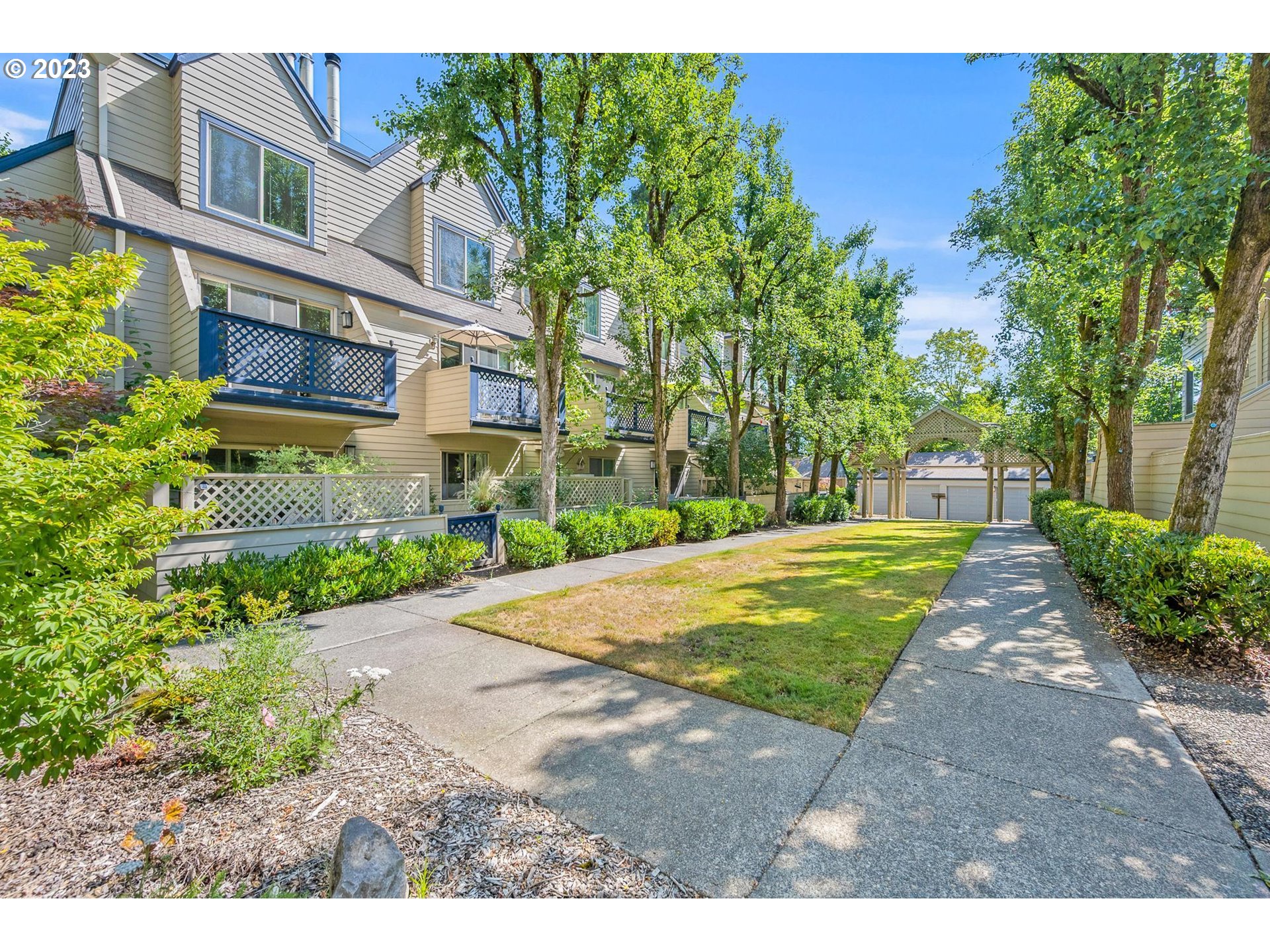 2785 Northwest Upshur Street, Unit B Portland, OR 97210 - Photo 28 of 35 a front view of a house with a yard