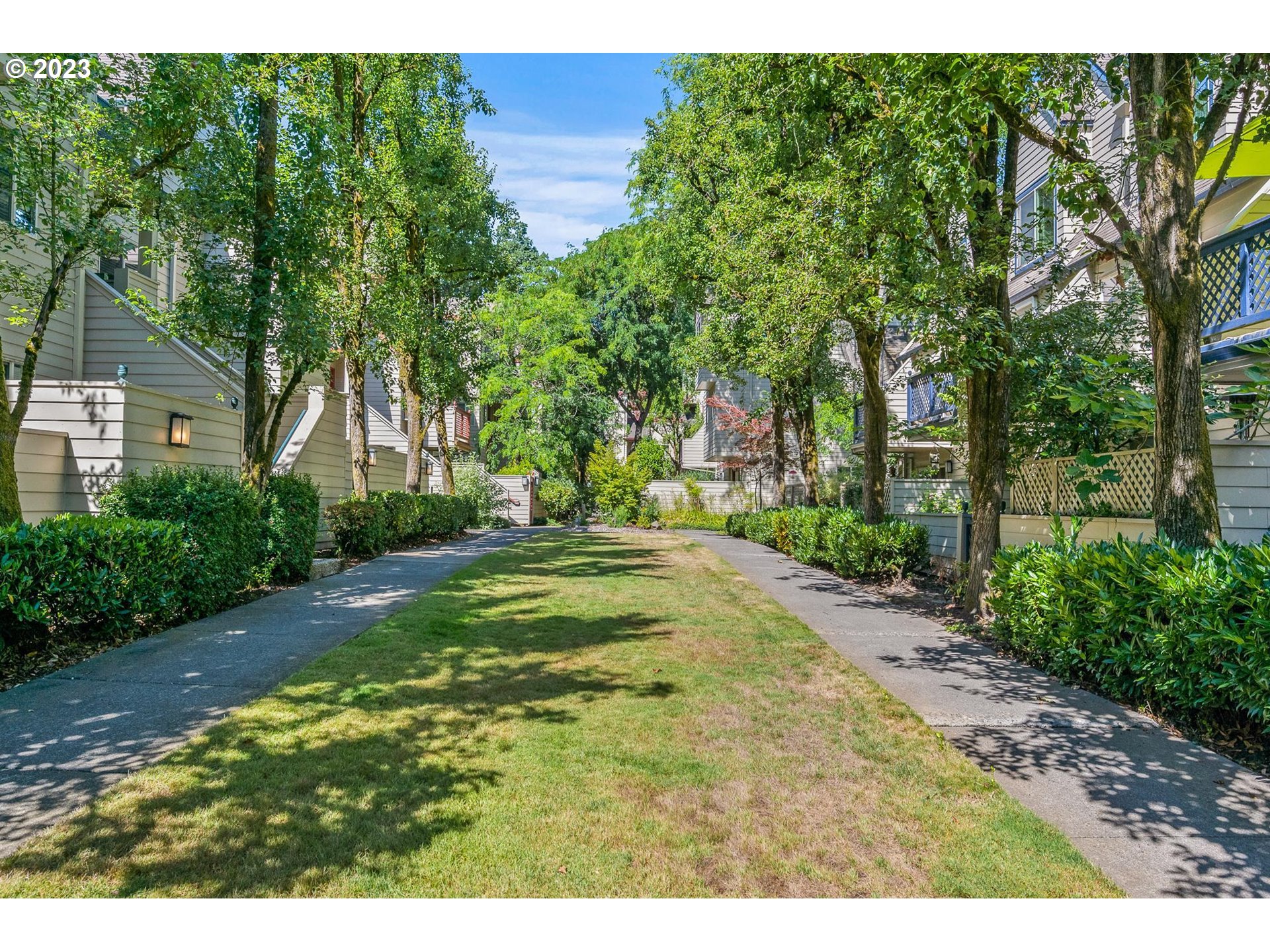 2785 Northwest Upshur Street, Unit B Portland, OR 97210 - Photo 29 of 35 a view of a yard with plants and large trees