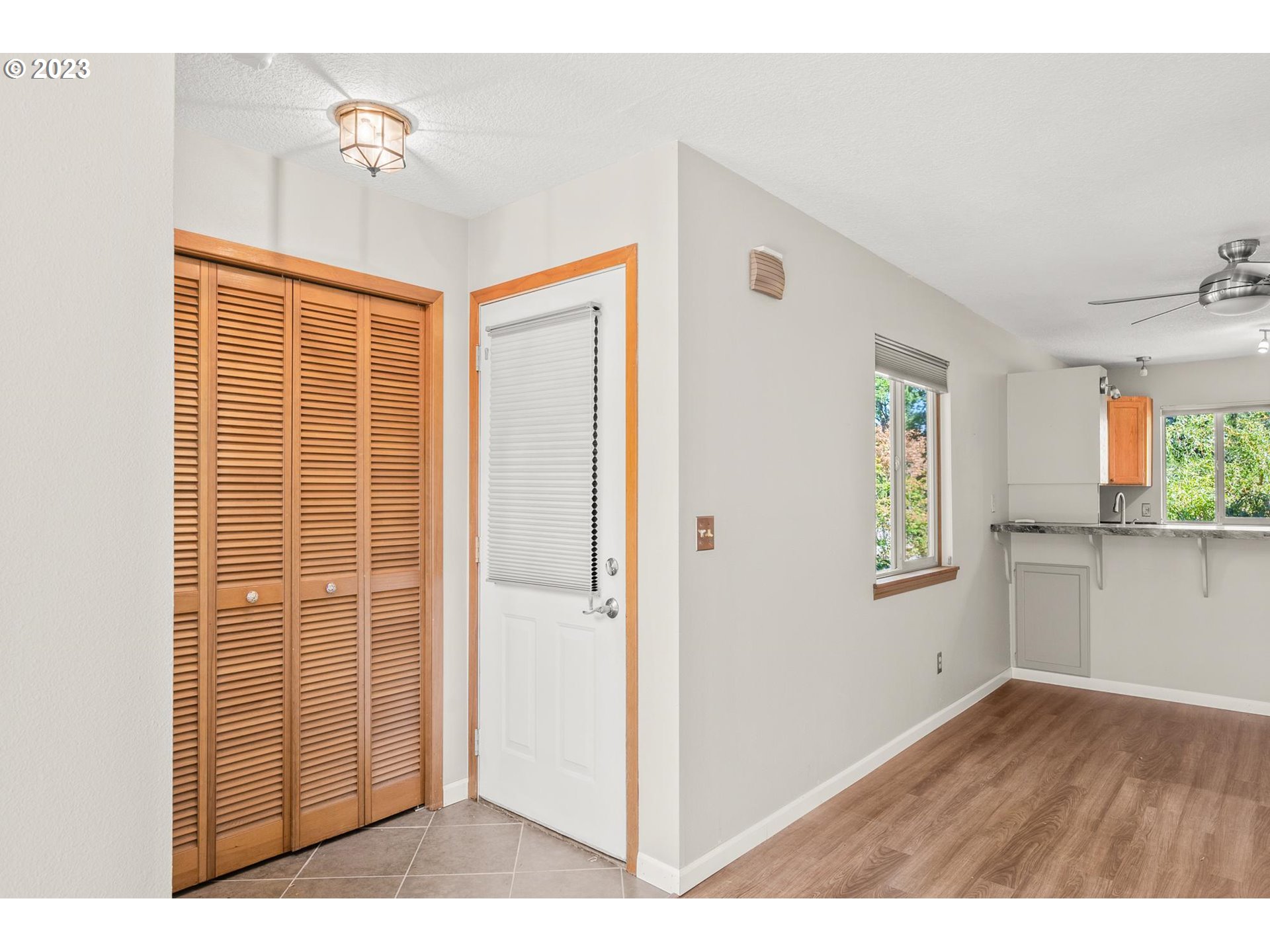 2785 Northwest Upshur Street, Unit B Portland, OR 97210 - Photo 9 of 35 a view of a livingroom with wooden floor and cabinet