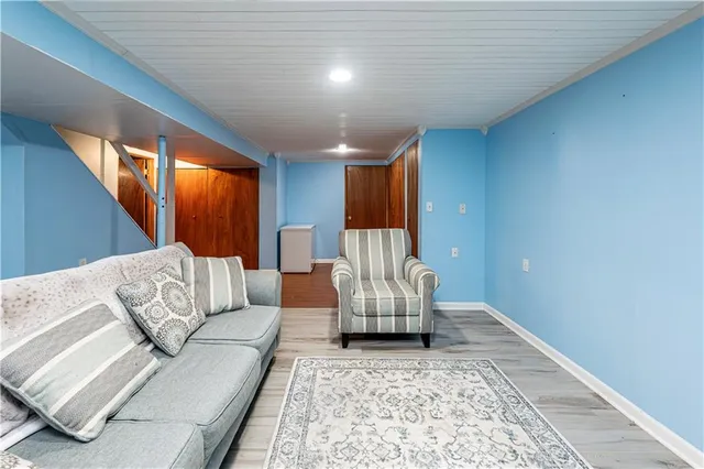 a living room with furniture and a rug