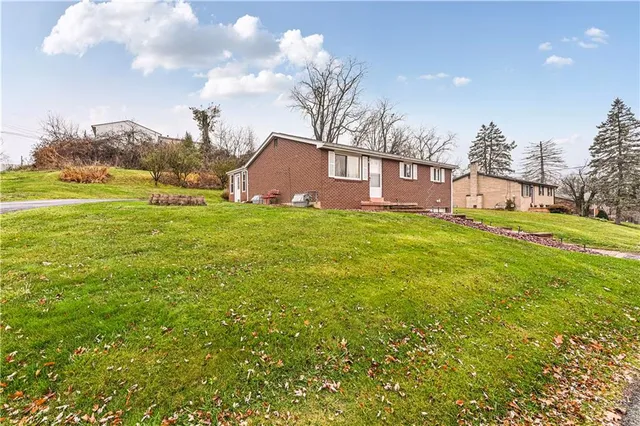 a view of a big yard with a house