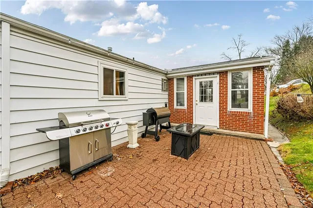 a spacious bathroom with a granite countertop sink and a mirror