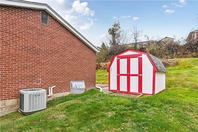 a view of a backyard with a garden and entertaining space