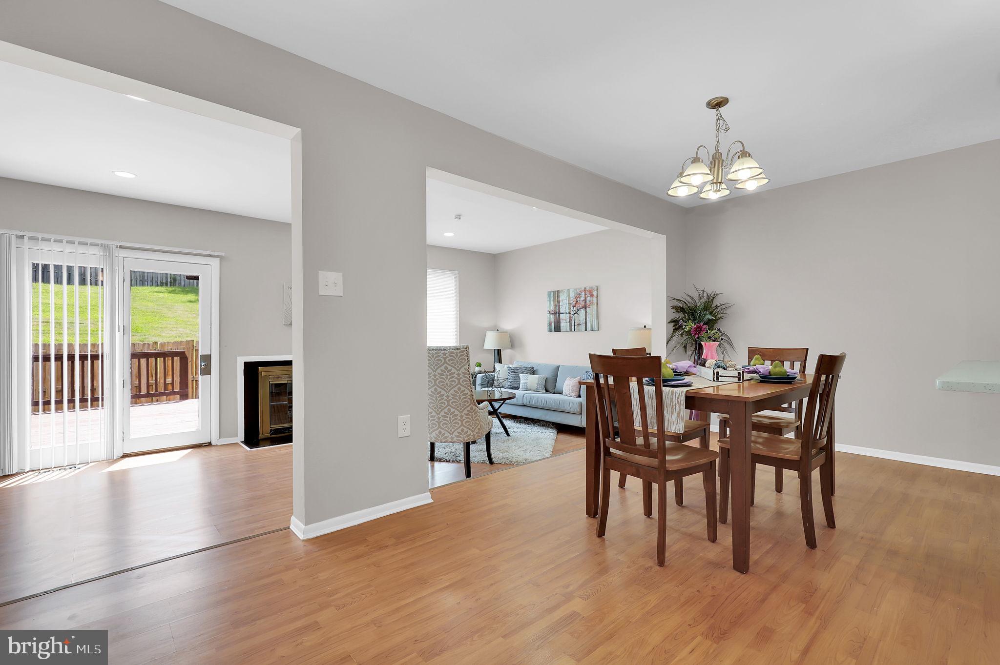 9012 Centerway Road Gaithersburg, MD 20879 - Photo 6 of 32 a view of a dining room with furniture and chandelier