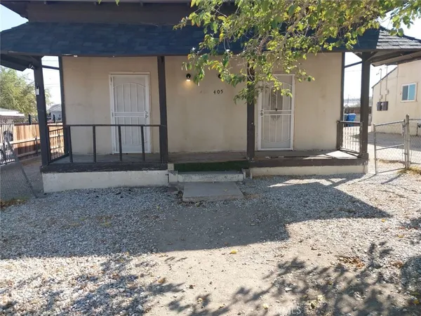 a view of a backyard of the house
