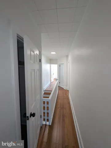 a view of entryway with wooden floor