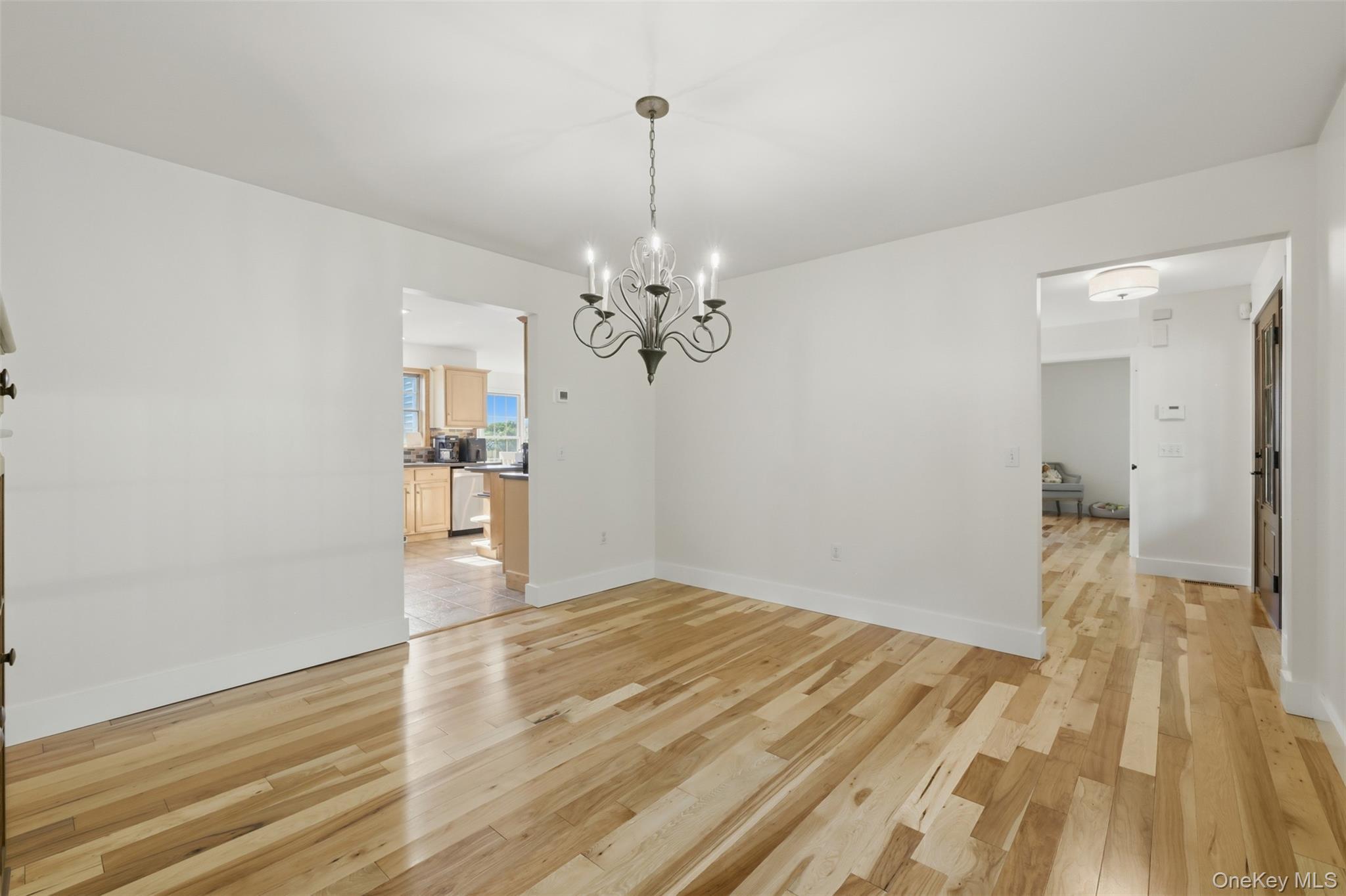 233 Devon Farms Road Stormville, NY 12582 - Photo 21 of 48 a view of a livingroom with wooden floor and a chandelier