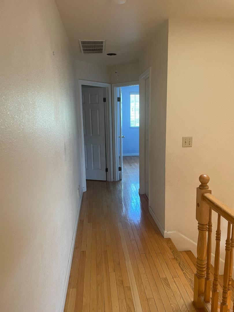 2294 Pinard Street Milpitas, CA 95035 - Photo 14 of 21 a view of a hallway with wooden floor and closet