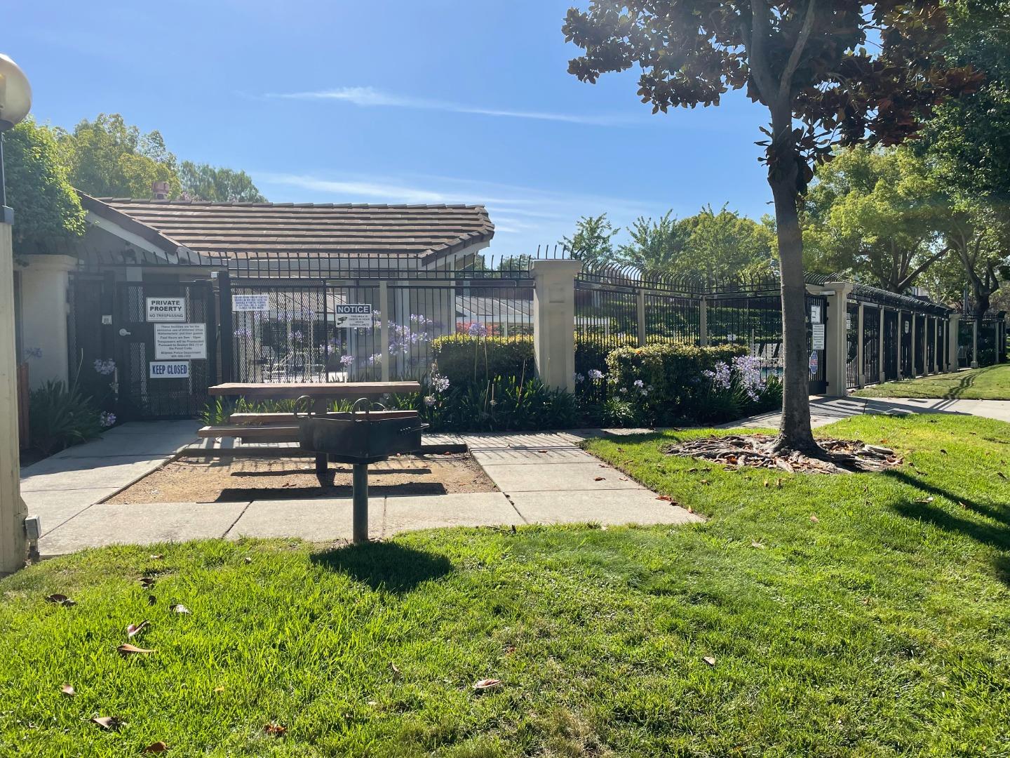 2294 Pinard Street Milpitas, CA 95035 - Photo 20 of 21 a view of a patio with a table chairs and a fire pit