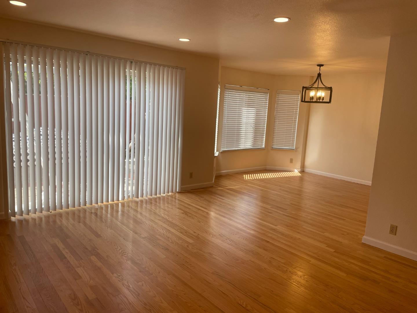 2294 Pinard Street Milpitas, CA 95035 - Photo 3 of 21 an empty room with wooden floor and windows