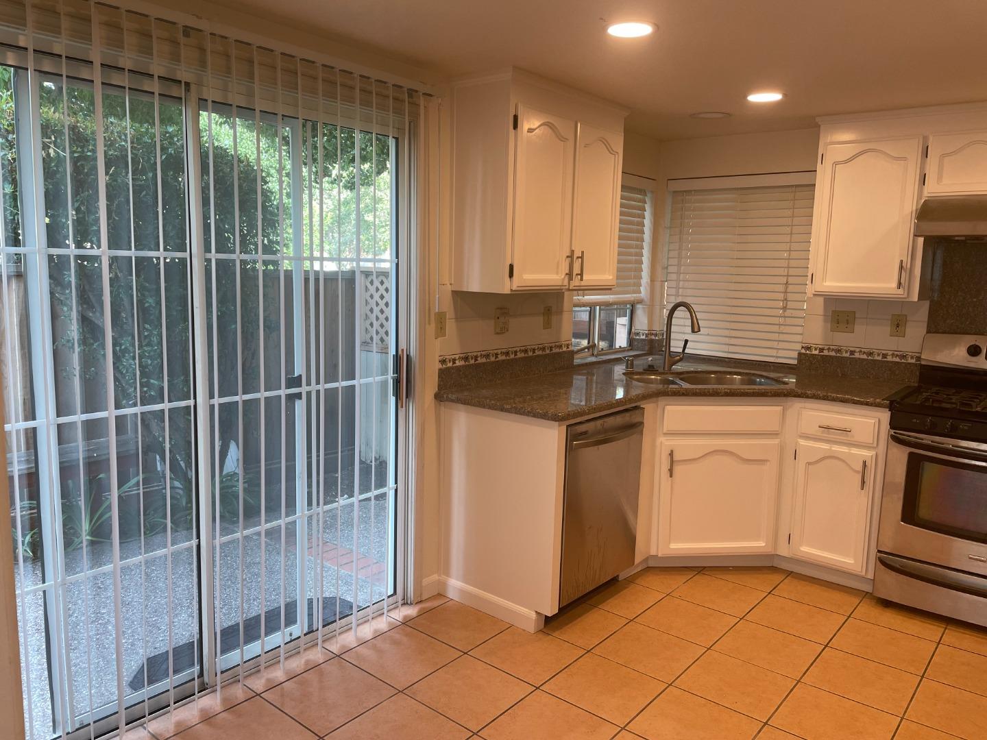 2294 Pinard Street Milpitas, CA 95035 - Photo 6 of 21 a kitchen with a sink stove and cabinets