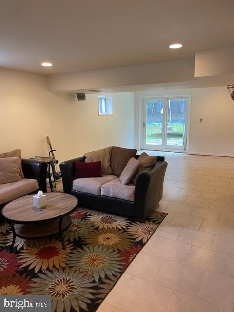 6540 Running Brook Road Manassas, VA 20112 - Photo 4 of 11 a living room with furniture and a rug