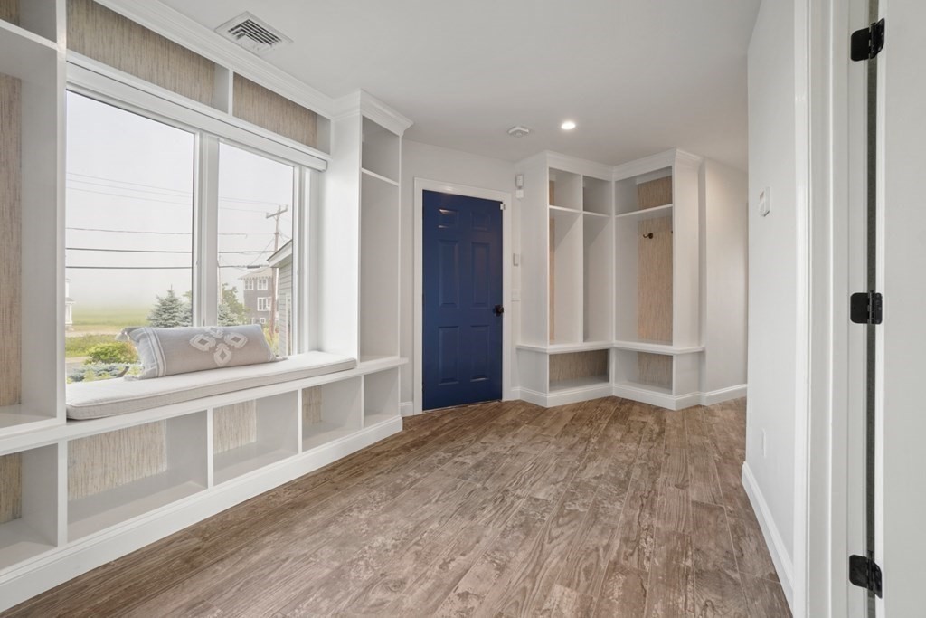 123 Gurnet Road Duxbury, MA 02332 - Photo 16 of 42 a view of empty room with wooden floor and fan
