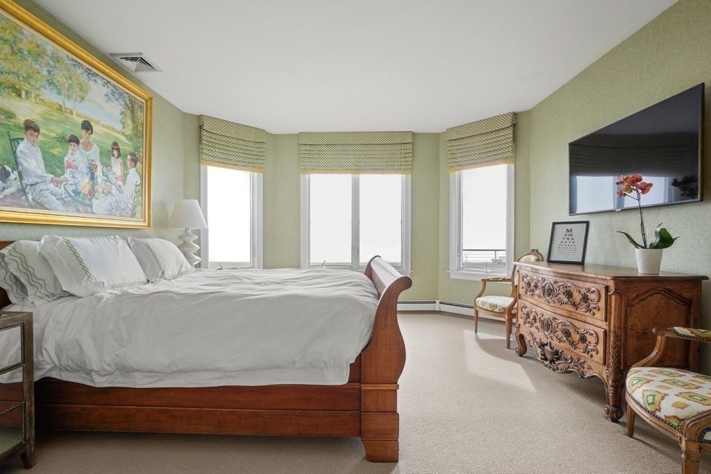 123 Gurnet Road Duxbury, MA 02332 - Photo 20 of 42 a bedroom with a bed and a flat screen tv