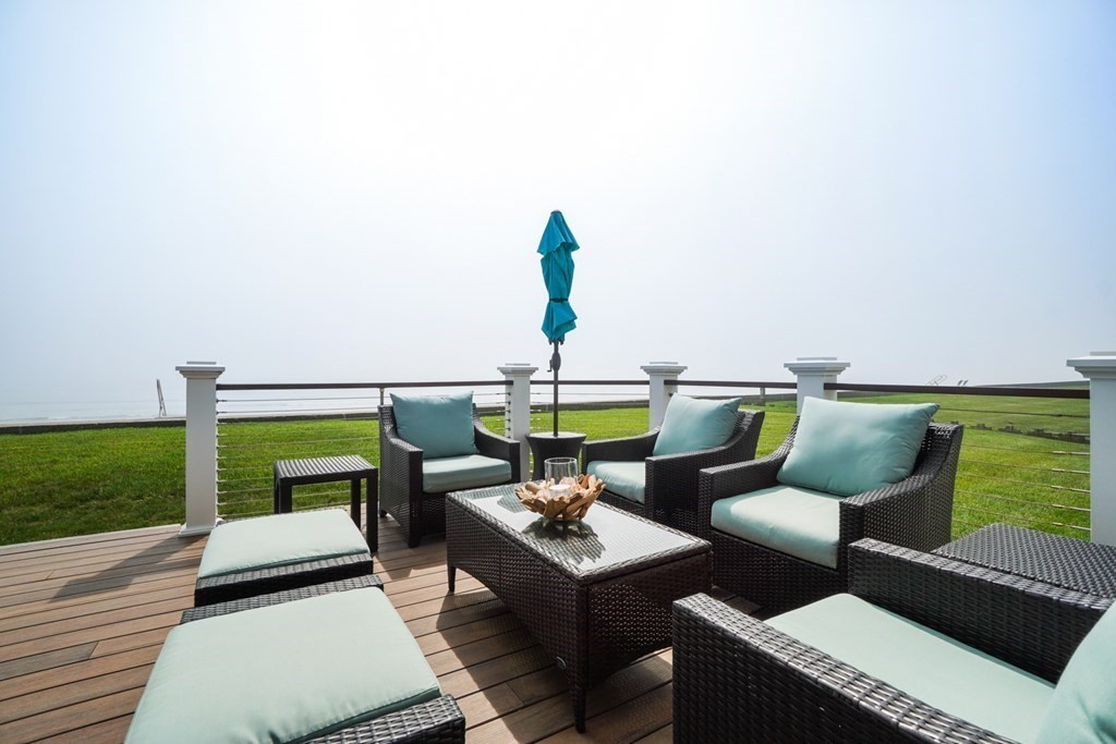 123 Gurnet Road Duxbury, MA 02332 - Photo 2 of 42 a balcony with view of outdoor seating