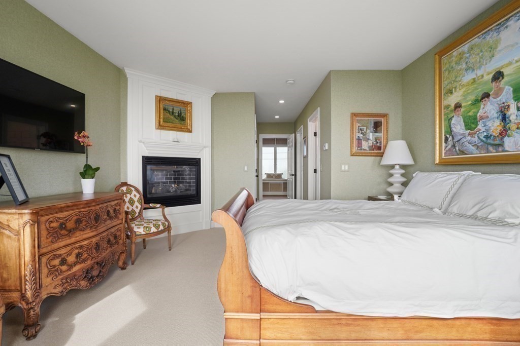 123 Gurnet Road Duxbury, MA 02332 - Photo 22 of 42 a bed room with a bed and a television