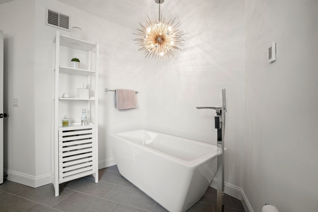 123 Gurnet Road Duxbury, MA 02332 - Photo 24 of 42 a bathroom with a sink a bathtub and a window