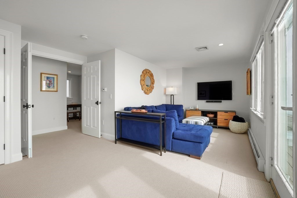 123 Gurnet Road Duxbury, MA 02332 - Photo 30 of 42 a living room with furniture and a flat screen tv