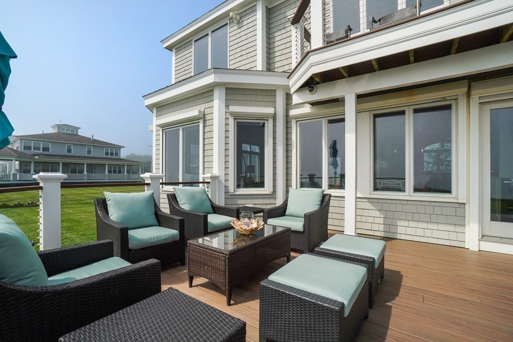 123 Gurnet Road Duxbury, MA 02332 - Photo 3 of 42 a view of a patio with couches chairs and wooden floor