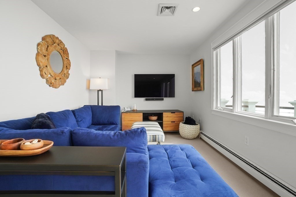 123 Gurnet Road Duxbury, MA 02332 - Photo 31 of 42 a living room with furniture and a flat screen tv