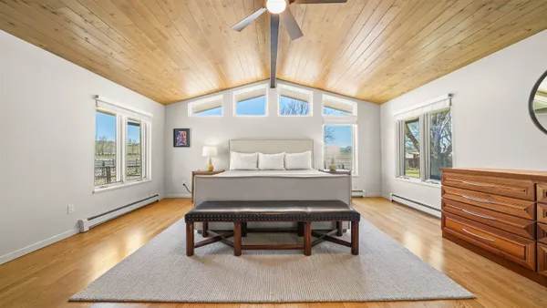 a living room with a bed furniture and a window