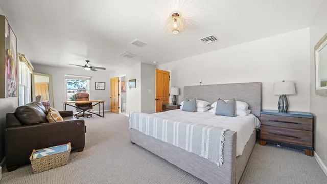 a bedroom with a bed and furniture