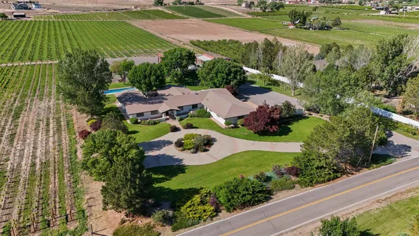 an aerial view of residential house with outdoor space and street view