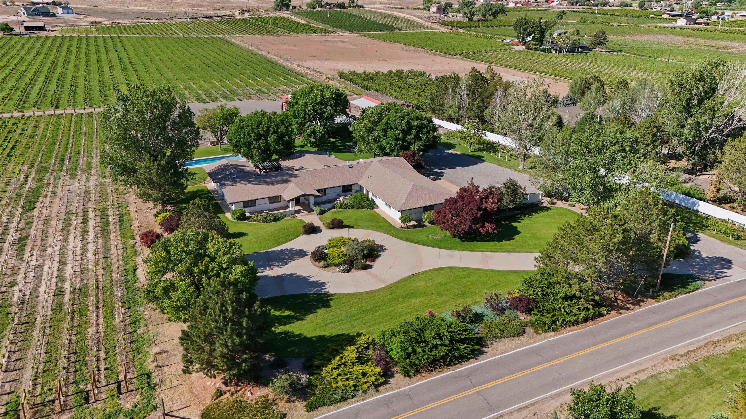3339 C Road Palisade, CO 81526 - Photo 2 of 39 an aerial view of residential house with outdoor space and street view