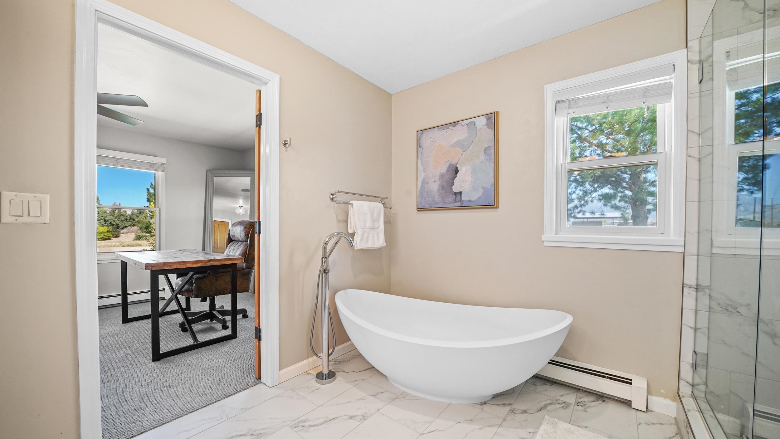 3339 C Road Palisade, CO 81526 - Photo 21 of 39 a bathroom with a toilet a sink and a window