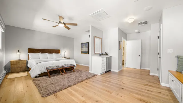 a bedroom with a bed and cabinets