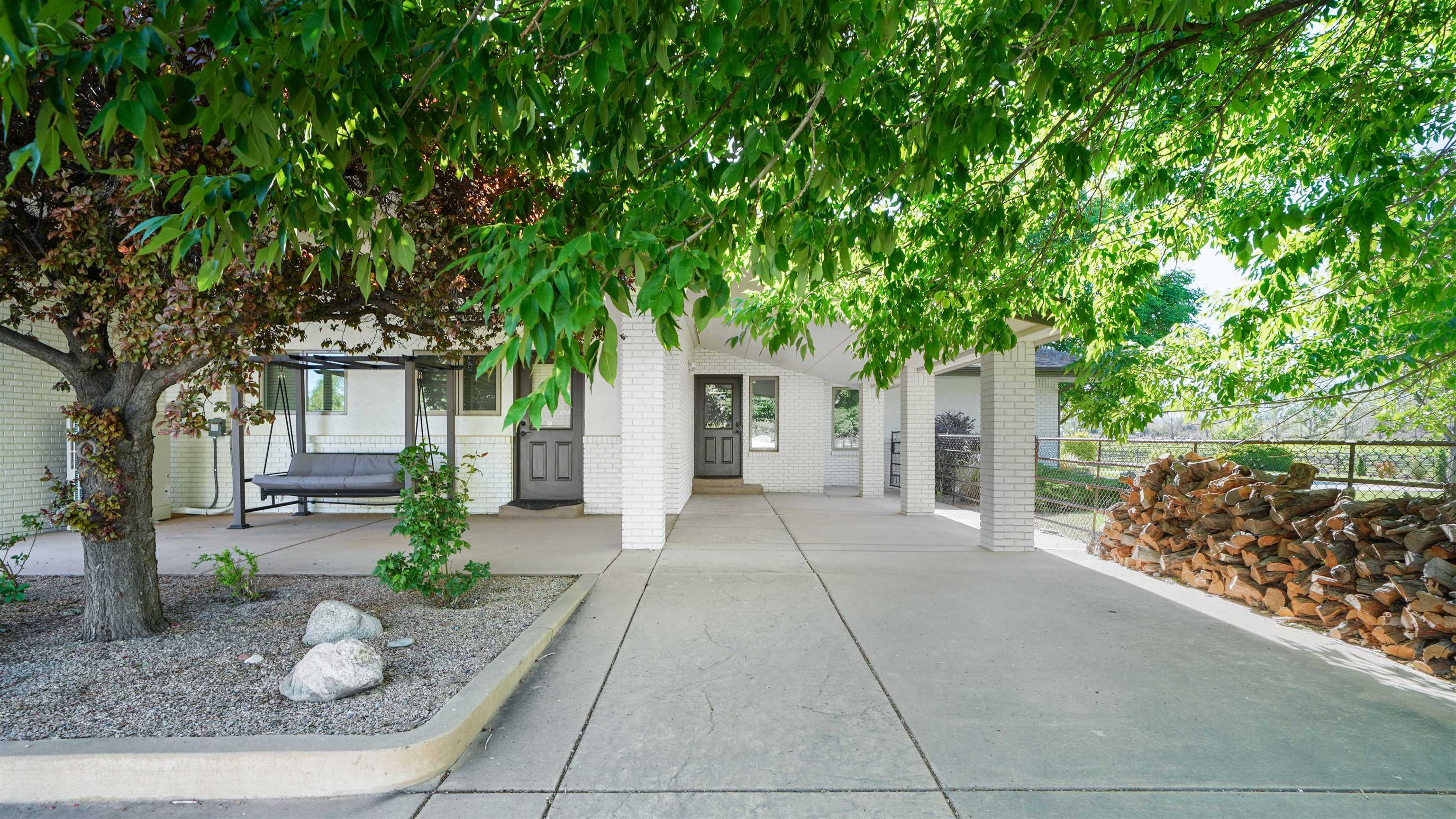 3339 C Road Palisade, CO 81526 - Photo 33 of 39 a view of a house with a tree in front