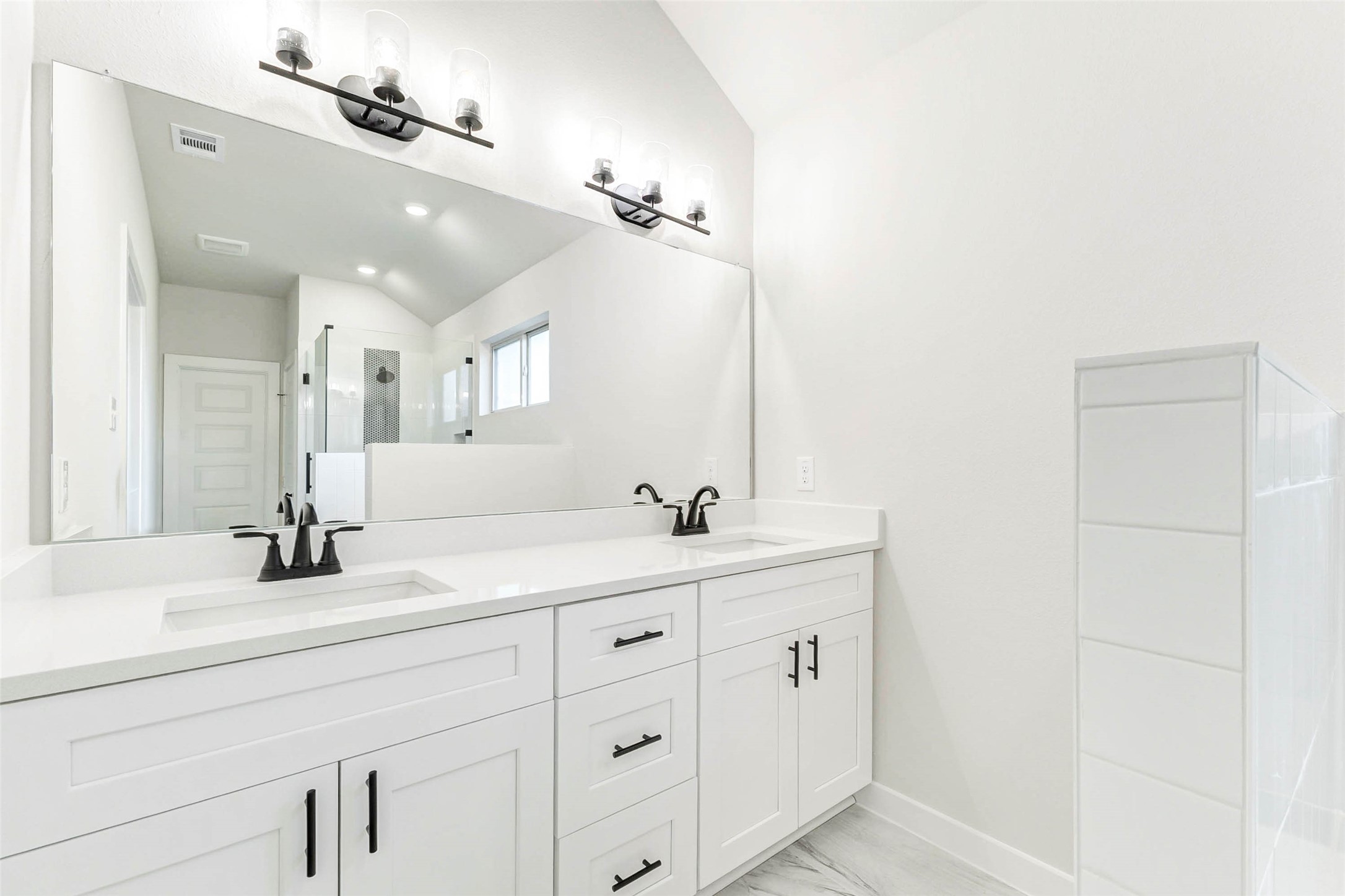 6422 Pomona Court Rosharon, TX 77583 - Photo 12 of 24 a bathroom with a double vanity sink and mirror