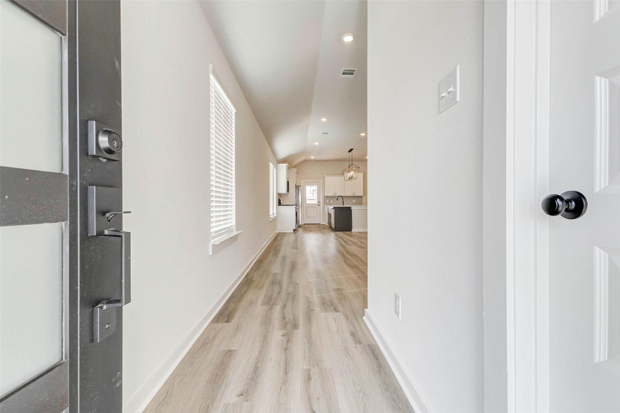 6422 Pomona Court Rosharon, TX 77583 - Photo 3 of 24 a view of a hallway with a wooden floor