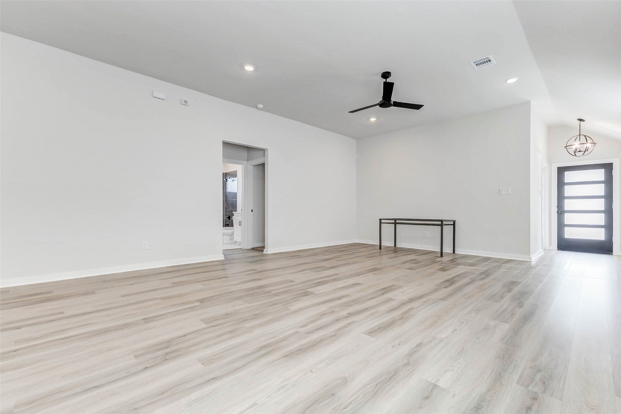 6422 Pomona Court Rosharon, TX 77583 - Photo 5 of 24 a view of an empty room with window and wooden floor